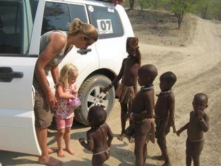 Handing out Marshmellows to the Himba on the Kuneni