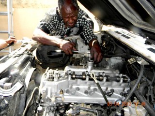 Mechanic installing new head